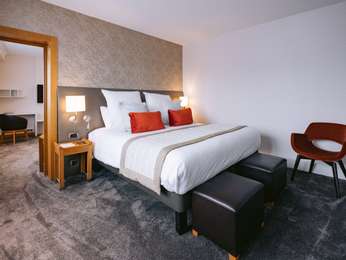 Family suite with city view, king-size bed + sofa bed in the lounge