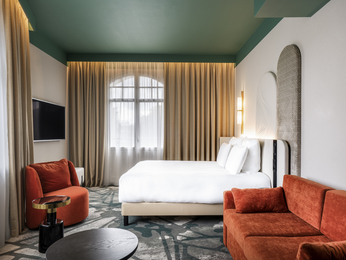 Deluxe room with king-size bed and sofa
